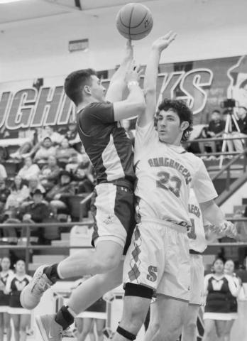 TOUGH SHOT - Whiteface Antelope Ethan Kauffman shot the ball against the Sundown Roughneck Nathan McAdams this past Tuesday night on the road. (Photo courtesy of Holly Crutcher)