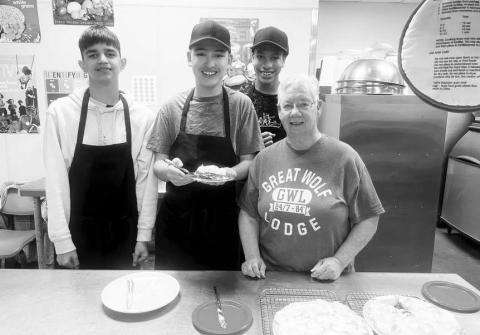 p DAY - LMS celebrated National Pi Day last week. Pi Day is an annual celebration of the mathematical constant p. Pi Day is observed on March 14 since 3, 1, and 4 are the first three significant figures of p. The Lobo Diner students with the help of Mrs Swain made homemade pies. Pictured from left to right are: Adair Miranda, Xavier Castro-Vela, Zalian Williams and volunteer Nancy Swain. (Photo courtesy of Cristal Isaacks).