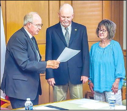 NEW SPC REGENT - The South Plains College (SPC) Board of Regents began their monthly regular meeting by appointing and administering the Oath of Office to Pete Stracener. Stracener received unanimous approval from the Regents to be appointed the Position Two Regent. Pictured is Chairman Mike Box administering the Oath of Office to Stracener alongside his wife Cathy. (Staff photo by Dom Puente)