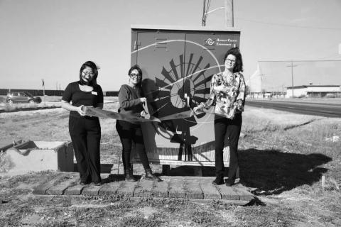 RAILROAD BUNGALOW - Pictured left to right are: Arra Delos Santos, Kim Rico and Cristal Issacks. The Levelland Chamber of Commerce held a Hockley County ribbon cutting ,celebrating the Endowment Bunglaow. It is newly rewrapped and can be seen by the railraod near Progressive Place and HWY 114. The project was made possible through the generous support of the Hockley COunty Endowment Grant Fund. (Staff photo by Hannah Woodrum)