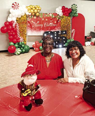 Pictured are Margaret Golightly and Marilyn Demons at the 25th annual Circle of Sisters event this past Saturday. The event is held on the second Saturday in December and allows for ladies of the Northside community to come together for food, fun and fellowship. Golightly and Demons graduated from high school together and the event allows them to catch up. (Staff photo)
