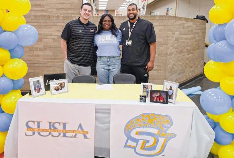 JOYCE SIGNS WITH SUSLA - Levelland Loboette Sydnii Joyce committed to Southern University Shreveport Louisiana to play collegiate basketball this past Wednesday in the Levelland High School commons area. Pictured with Joyce are Levelland’s Coach Bell (left) and Coach Flemmons (right). The SUSLA Lady Jags compete in NJCAA Division 1. (Photo provided by Levelland ISD)
