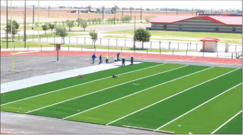HIGH-PERFORMANCE TURF - Workers began to install the new turf onto the Levelland High School football field. The multi-step installation replaces the stadium's older playing surface with modern, high-performance turf. The new turf comes thanks to Hockley County Credit Union. (Staff photo by Trinity Bourdeaux)