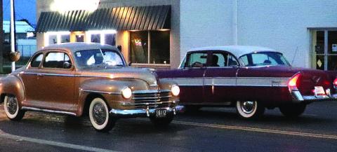 CRUISINGDOWNTHESTREET - Car enthusiasts spent Friday evening cruising down Houston Street and around downtown in Levelland. Spectators gathered in parking lots and open spaces along the roads to watch different types of cars and trucks on display. (Staff Photo by Shawn Fanklin)