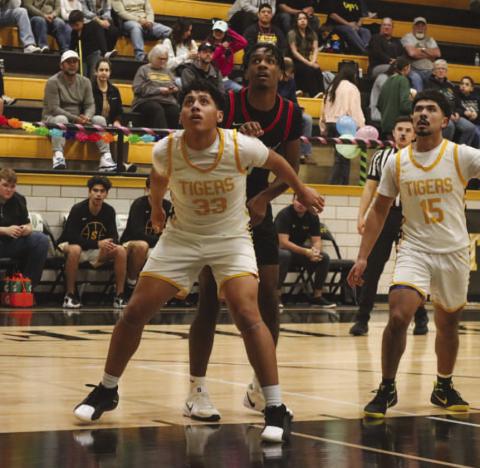 REBOUND - Levelland Lobo Eryk Jones fought for positioning underneath the basket this past Friday night against the Snyder Tigers in district play. (Staff photo by Aalijah Soliz)