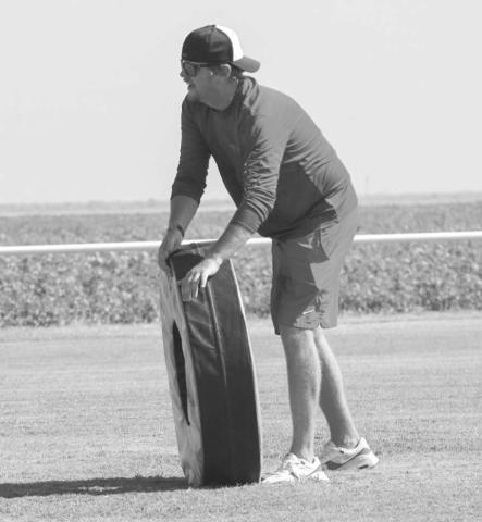 TACKLING WHEEL - Last Monday morning Whitharral Coach Matt White rolled the tackling wheel for the youth at their All-Sports Camp. (Staff photo by Aalijah Soliz)