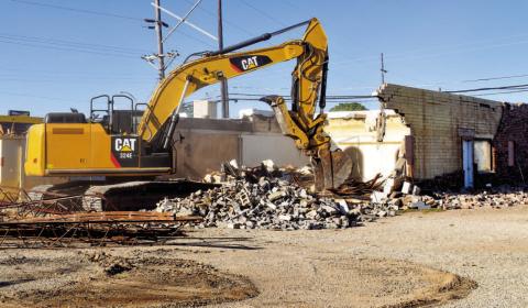 DEMOLITION - The demolition of the building formally known a Mexiteria Restaurant located on the corner of Maple Street and College Avenue. Demolition of the building began last Thursday. (Staff photo by Emily Campos)