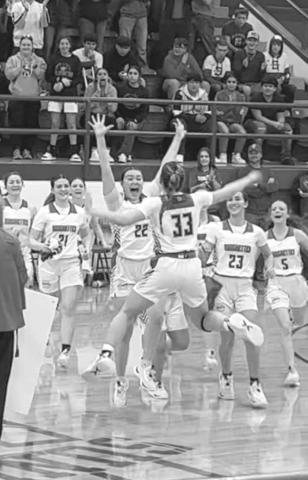 RECORD - Right after Allie McCormick scored her 100th point, the team called a timeout to celebrate her, including Coach Kim Watson and her teammates as they jump around with her. (Photo courtesy of Amber Wisdom)