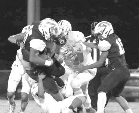 WRAP UP TACKLE - The Whiteface Antelope defense shut the host Meadow Broncos down in a 64-0 UIL Region II, District 5, 6-man Division I High school football win last Friday. The Antelopes, ranked sixth in the state and 12th in the country. will host O’Donnell next Friday for the district championship at 7:30 p.m. (Photo by Holly Crutcher)