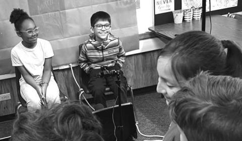 STUDENTS TEACHING STUDENTS- Mrs. Barbara Utley’s third grade GT students at Capitol got some help from Mr. Scott Lawson’s Digital Media &amp; Career Prep students on their News Show Production project. Students learned how to use a green screen, read from a teleprompter, crop, edit recorded videos, and insert background. Pictured are Shaylle Whitfield and Landon Rodriguez (Photo courtesy of Cristal Isaacks)