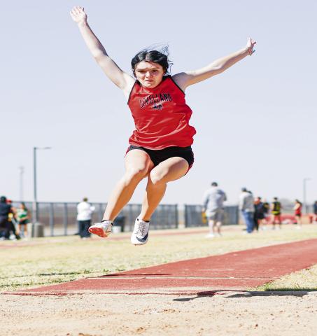 TRIPLE JUMP FORM - Levelland's Presley Smith takes flight for a triple jump during the their home track meet this past Friday at Lobo Stadium. Smith would place third with a jump of 32’6”. (Staff photo by Jentezen Smith)