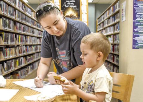 BOOKS & BAGELS - Pictured are Michaela and Colt Dejoungh while they had a blast coloring and together at Books and Bagels on Wednesday at the Hockley County Memorial Library. (Staff photo by Hannah Woodrum)