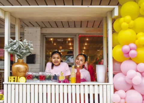 - Pictured is Sophia Lopez and Alicia Hernandez who won Best Decorated Stand on Saturday during Main Streets Lemonade Day and Community Planting Day. (Staff photo by Hannah Woodrum)