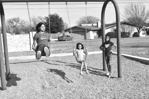 ENJOYING SPRING BREAK- Tuesday was the perfect weather to have fun in the park . In photo sisters Lilliey Barrera, Annavey Barrera, and cousin Keyna Gonzales are enjoying there free time from school to have fun at Barlett Park .(Staff photo by Emily Campos)