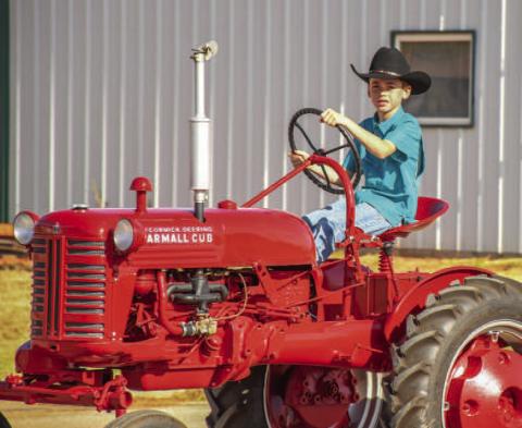 RIDING IN STYLE - The Sundown Chamber of Commerce held their annual Oil Patch Day event Saturday, which included the Oil Patch Day Parade to begin the day. Pictured is Sundown’s own Logan Jeffcoat participating in the parade. (Staff photo by Dom Puente)