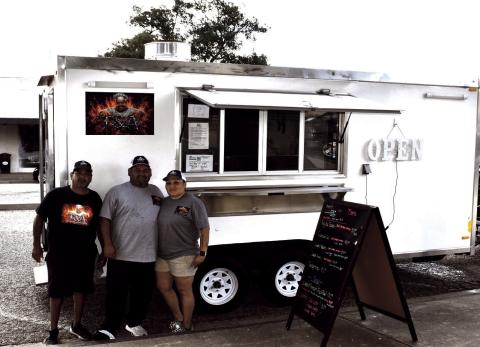 T&A – Pictured are Amador, Troy and Jennifer Andrade with their truck on the square. Every third Thursday from March to September is Food Truck Day Day. (Staff photo by Ada Niederhauser)