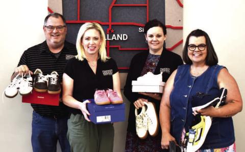 SHOES, SHOES, SHOES - Pictured left to right are Russell Vest, Breann Buxkemper, Kylie Boggs and Angie Vest HCCU employees displaying shoes for the annual shoe drive. (Staff photo)