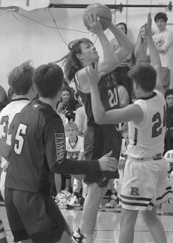 TWO POINTS- Drew Overstreet went up for a basket in a 55-31 Smyer Bobcat road loss to the Ropes Eagles last Tuesday in UIL high school boys’ basketball action. Overstreet had two points in the effort. The Bobcats will be in the Nazareth Tournament this weekend while the Eagles are in the Anton Tournament. (Photo Courtesy of Jay Kelley)