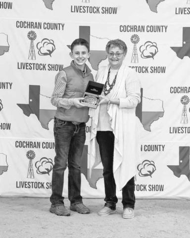 RESREVE GRAND CHAMPION GOAT- Parks Tucker was presented a buckle for Reserve Grand Champion Goat doanted and presented by Wayne and Cheri Butler on Saturday at the Cochran County Livestock Show in Morton. (staff photo by Essence Childers)