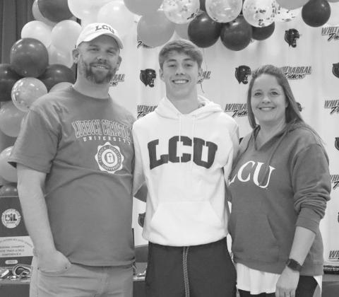 SIGNING - Whitharral Panther Landon Lee signed to LCU this past Wednesday for track and field while this family in front of his peers. Pictured above is Landon Lee and his parents Craig and Brandi Lee. (Staff photo by Aalijah Soliz)