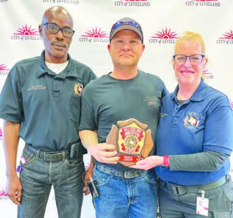 ROUND OFAPPLAUSE - Willie Goolseby (center) was awarded the Volunteer - Firefighter of the Year at the LFD awards banquet held on Saturday. Pictured alongside Goolseby is Curt Masters (left) and Interim Fire Chief Patty Byars-Faulkner (right). (Photo courtesy of the LFD)