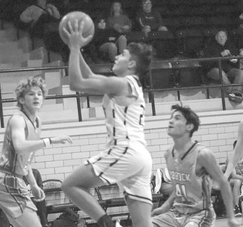 BREAKDOWN - Morton Indian E.J. Rivas broke the zone defense of the Lubbock Titans last week at home where he layed the ball up getting the team some much needed points. (Staff photo by Aalijah Soliz)