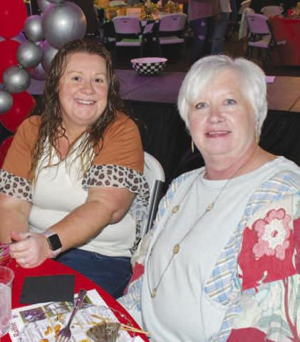 STAGE VIEW – Darla Burton and Tori Elliott ate and talked together at their reserved table for the Fa La La event in Levelland Dec. 12. (Staff photo by Evin Thomas)