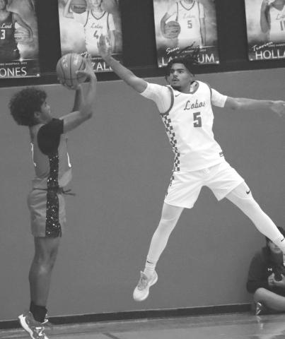 EFFORT - Levelland Lobo Sean Landrum went vertical to block the Brownfield Cub players shot last Friday. (Staff photo by Aalijah Soliz)