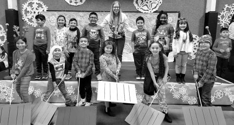 LET IT SNOW! LET IT SNOW!– Capitol second grade held its performance of “On With The Snow!” The program included rappers and snow shovelers, under the direction of Capitol Music Teacher Miss Draper. Pictured are rappers: Joshua Barrientes, Layla Carranza, Dania Corrales, Leonardo Ochoa Perez, Titus Phillips and Keilany Rosales; and shovelers: Giovanni Aguilar, Ximena Faria Hernandez, Kaylee Garza, Cruz Martinez, Aaron Santos, Journee Taylor and Jose Ybarra, and Miss Susan Draper. (Submitted Photo)