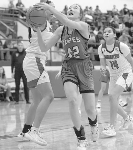 UNDER MOVE- Lady Eagle Ava Grace Falls slipped under a Sundown defender in a losing effort against the Roughettes (Photo Courtesy of Donovan Martin)
