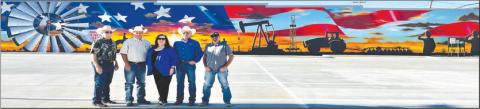 MURAL FOR THE COMMUNITY - The parking lot project was recently completed with Muralist Alfonso Garcia of Tulia completing his mural on the wall facing the lot. The parking lot is located across the Hockley County Annex at the corner of Austin Street and Avenue H. Pictured from left to right are: Tommy Clevenger, Alan Wisdom, Sharla Wisdom, Larry Carter and Seth Graf. (Photo courtesy of Kelli Martin)