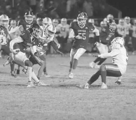 TOO QUICK - Smyer Bobcat Ryan Gutierrez juked to the defenders outside shoulder to make him fall this past Friday during Smyer’s last game of the season against Tahoka. (Photo courtesy of Joe-Andrew Garcia)