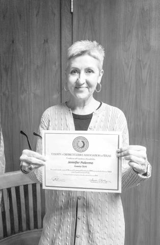 CERTIFICATE OF COMPLETION - During the Hockley County Commissioners’ regular meeting Monday morning, the Commissioners accepted the Certificate of Completion awarded to Hockley County Clerk, Jennifer Palermo. (Staff photo by Dom Puente)