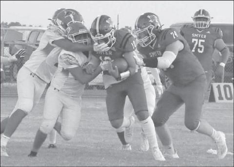 RUN PLAY - Peyton Casillas, coming off an injury against Ralls in the week prior, had multiple carries for the Smyer Bobcats in a 42-20 homecoming loss to the Floydada Whirlwinds. The Bobcats will travel to Clarendon next Friday for a 7 p.m. game. Clarendon is currently ranked 18th in class 2A-2 by MaxPreps. Last season the Broncos defeated the Bobcats 55-8 in Smyer. (Staff photo by Jay Kelley)