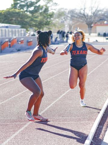 PURE PAIN - South Plains College’s Shahyna Coudriau finishes her leg of the 4x400-meter relay and hands the ba - ton off to her teammate Cheffonia Houston at the SPC West Texas Shootout this past Saturday at the South Plains College track facility. (Staff photo by Jentezen Smith)