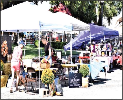 SETTING UP SHOP- Local vendors and food trucks were on hand this Saturday for the annual Falling for The Wallace. Downtown businesses were also open making a full day of shopping for community members. (Staff photo by Lynda Work).