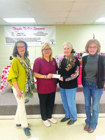 SUCCESSFUL QUILT RAFFLE-- Members of Xi Theta Pi recently donated to the Hockey County Senior Citizens Association. The proceeds were from the quilt raffle held in December by Xi Theta Pi (Photo courtesy of Ann Capps)