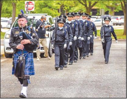 HONORINGFALLEN PEACE OFFICERS - South Plains College held their annual Peace Officer Memorial Service on April 30. Pictured is Michael Mogan of the Lubbock Airport Police Department playing the bagpipes and leading the SPC Law Enforcement Honor Guard to begin the service. (Staff photo by Dom Puente)