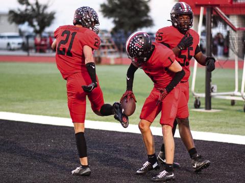 TD CELEBRATION - Senior Kaden Brogden celebrates his punt return touchdown with his junior teammate Jake Potter during Levelland’s Homecoming football game this past Friday night. The Lobos would go on to win 50-0. (Staff photo by Jentezen Smith)