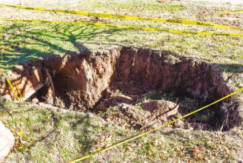 POSSIBLE SAFETY HAZARD - Whitharral homeowner John Dea shared that a sink hole formed on his property following the last heavy rainfall that swept across the area. Dea highlighted that the incident has happened within the area before and can be a potential safety hazard for those walking around the unsuspecting area. Property owners are encouraged to scan their area for possible signs of topsoil giving away following inclement weather. (Staff photo by Evin Thomas)