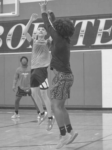 THREE - Levelland athlete Jacobi Shaw shot a three pointer with Levelland Lobo Anthony Gonzalez contesting his shot this past Monday at the Levelland Middle School during open gym workouts. (Staff photo by Aalijah Soliz)