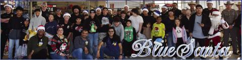 Pictured are participants in the Blue Santa event at Walmart on Saturday. The event started at the fire station where children got in police cars to be escorted to Walmart where police department personnel bought Christmas gifts for them. (Staff photo by Ada Niederhauser)