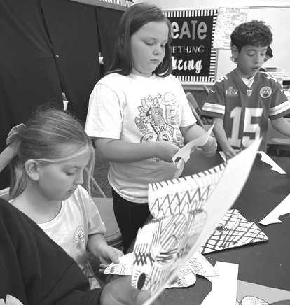 EASTER ART- Hippiti-Hoppity Easter’s on its way! South students were caught this week creating Easter art. They had to use their fine-motor skills for these small Bunnies. They had to use their math skills to show symmetry to the other Bunnies. South thanked Mrs. Bara for always engrossing kids in the most intriguing art activities. Pictured are: Trace Gavina, Jordan Brown (middle). (Photo courtesy of Cristal Isaacks)