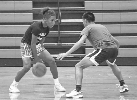 HANDLES - Levelland athlete Bentley Sepulbeda worked on his dribbling skills with Zeke Martinez this past Monday at the Levelland Middle School during gym workouts. (Staff photo by Aalijah Soliz)