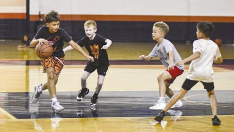TWO-ON-TWO – Preston Birdwell, Silas Peña, Kyler Dent and Xander Guillen play a basketball game of two-on-two during the Levelland Lobo Basketball Camp at the Texan Dome on August 5. (Staff photo by Jentezen Smith)