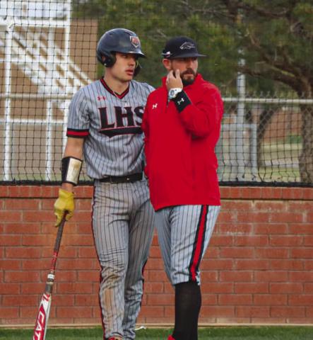 TALK IT OVER - Levelland Lobo Rusty Johnson and Head Baseball Coach Chris Portwood talked the game over during the team’s game this past Friday against Sweetwataer at home. (Staff photo by Aalijah Soliz)
