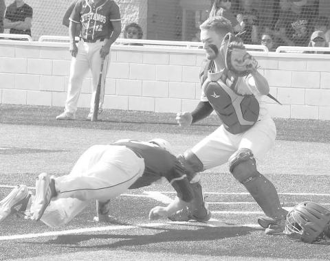 FIRST TEAM CATCHER- Smyer catcher Caleb Clausen went for a tag against an Olton runner in game one of the UIL Class 2A High School Bi-District Playoff against Olton in Littlefield. Clausen was selected as first team catcher for the District 4-2A All-District team. (Photo Courtesy of Jay Kelley)