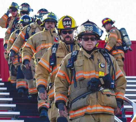 REMEMBERING THOSE LOST - Members of the Levelland Fire Department, Levelland Police Department, Hockley County Sheriff's Office and Texas Highway Patrol participated in the 9/11 Memorial Stair Climb at Lobo Stadium earlier Wednesday. The climb was done to honor those who paid the ultimate sacrifice during the 2001 terror attacks and remember those who were lost. (Staff photo by Dom Puente)