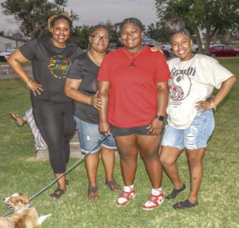 FAMILY FUN - Pictured from left to right are: Jazmine Sanchez, Valerie Dent with her two daughters Geazjia Holland and Nivea Holland enjoying their time at the 35th annual Juneteenth Celebration. The event is held yearly at L.G. Griffin Park in Levelland. (Staff photo by Essence Childers)