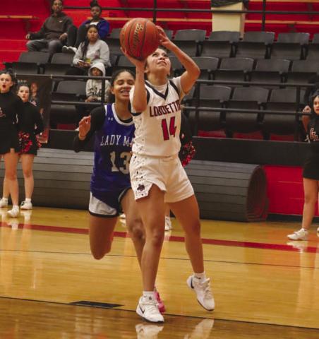 EASY LAY-IN - Levelland Loboette Kaylee Penner layed the ball up during the team’s fastbreak against the Estacado Lady Mats at home. (Staff photo by Aalijah Soliz)